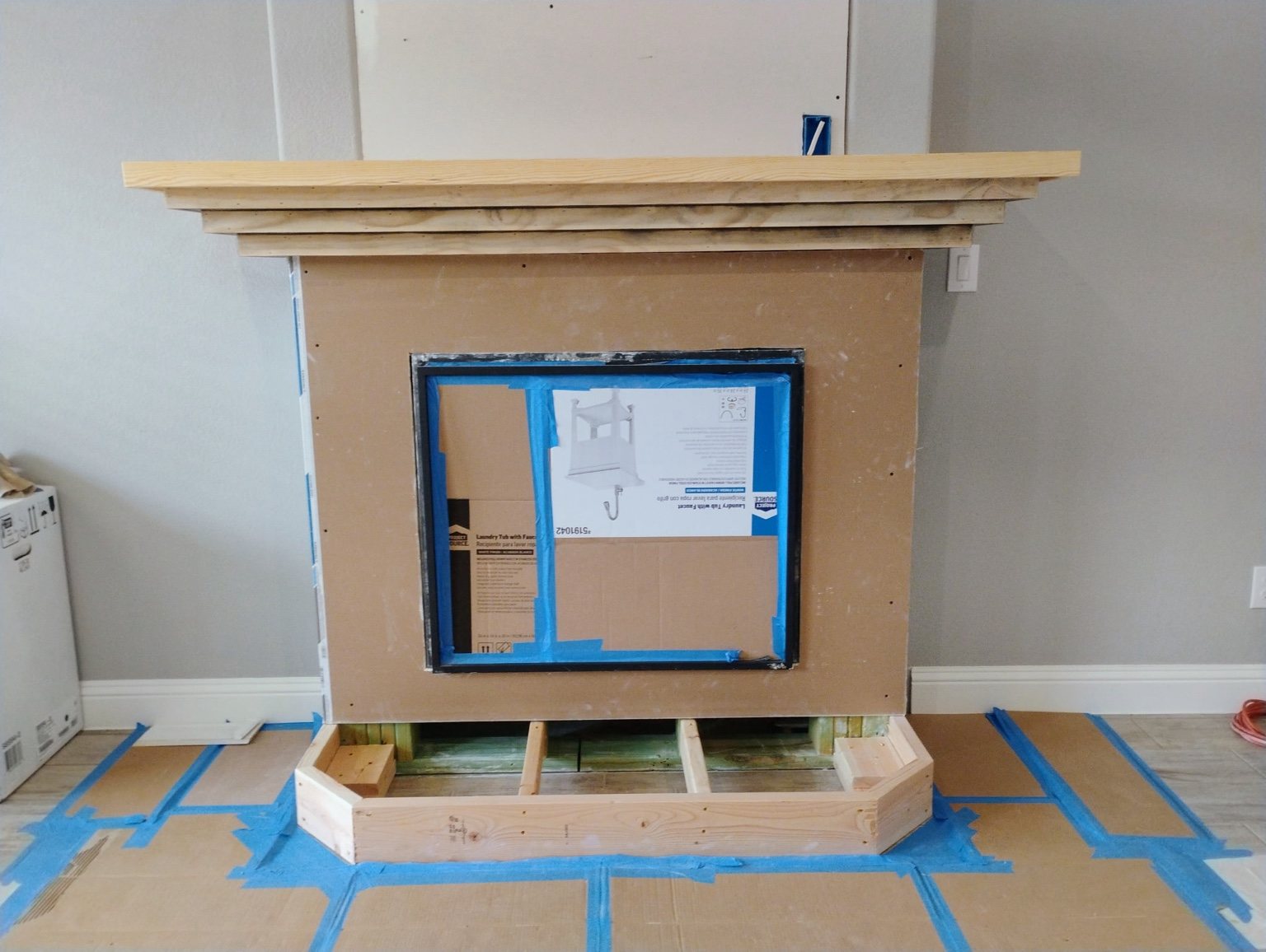 Builder-grade fireplace before renovation