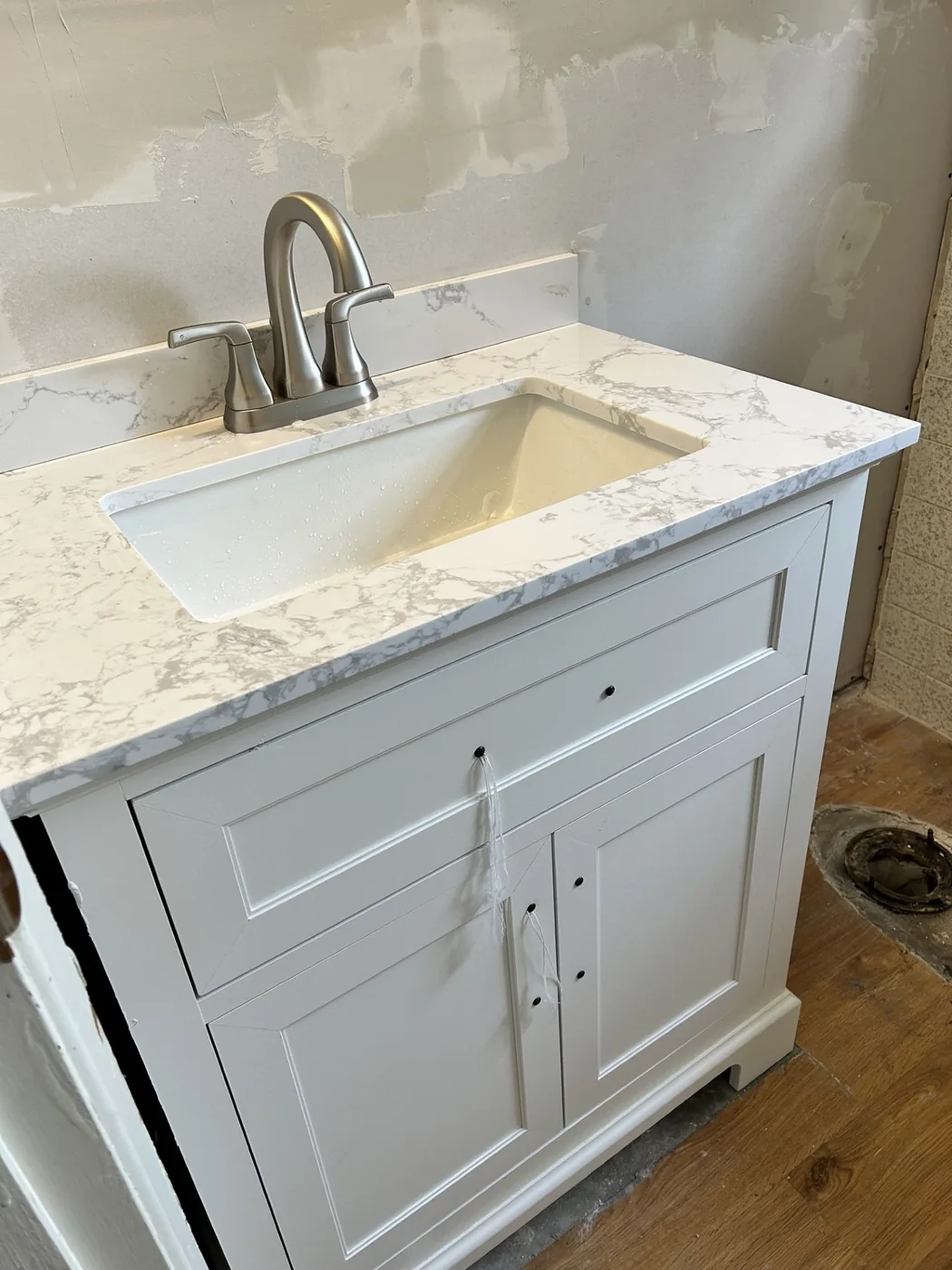 New vanity, countertop, sink and faucet installation.